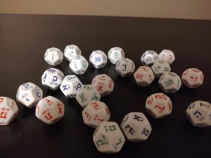 Customized 12-sided Hebrew dice are used in an upcoming "Milhamah" RPG.